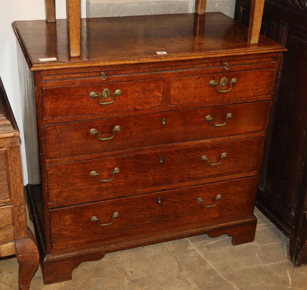 A George III oak chest with brushing slide, W.89cm